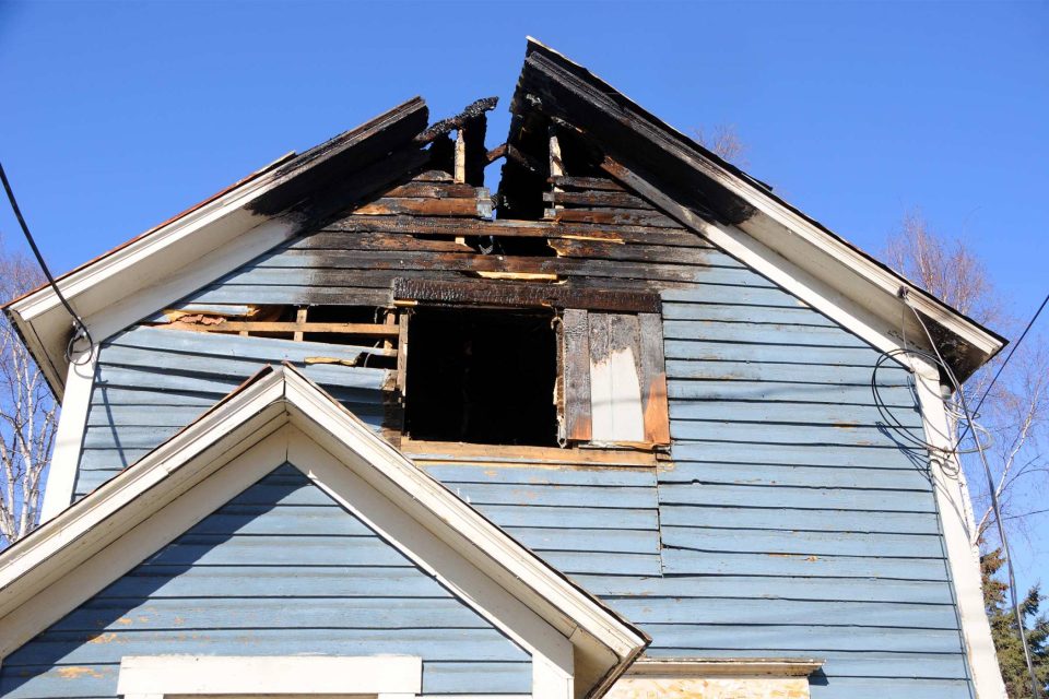 Storm and fire damage to a home exterior in the Staten Island service area